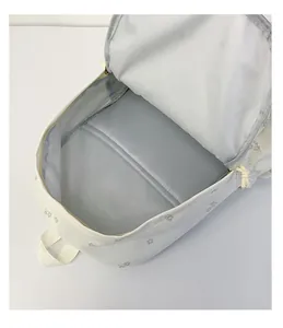 Interior detail of floral print student backpack showing padded laptop compartment