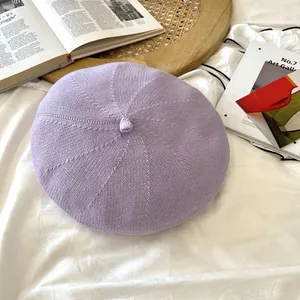 Close-up of a light purple knitted beret hat for women with a vintage artistic style
