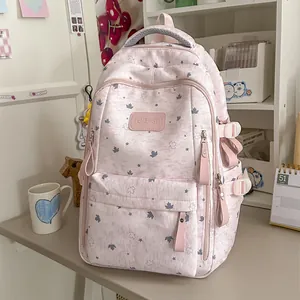 Sweet pink aesthetic backpack with star and maple leaf patterns in a cozy room setting