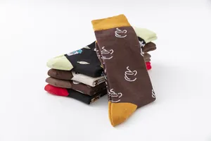 Close-up detail of colorful mid-calf cotton socks featuring coffee and drink patterns
