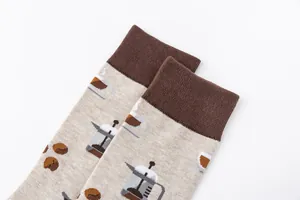 Close-up detail of high-quality cotton socks with coffee press and bean patterns