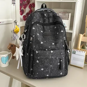Stylish black backpack featuring white star patterns in a sweet Korean aesthetic for daily travel