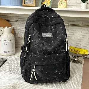 Casual black backpack with heart pattern and large capacity in a lifestyle scene