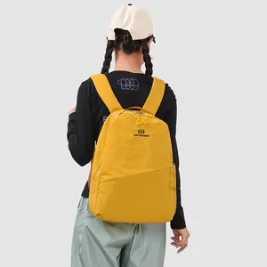Back view of a yellow Japanese style outdoor sports backpack for students and travel use