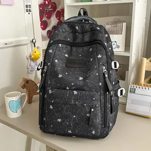 Stylish Korean style black backpack featuring star and maple leaf patterns for daily travel