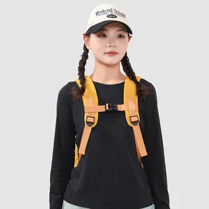 Close-up of adjustable chest strap buckle on a yellow outdoor backpack for students
