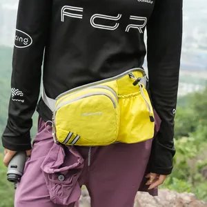 Detail view of a vibrant yellow nylon crossbody bag for women's sports and outdoor activities