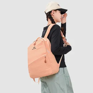 Asian model wearing a stylish orange Japanese style casual backpack for school or travel.