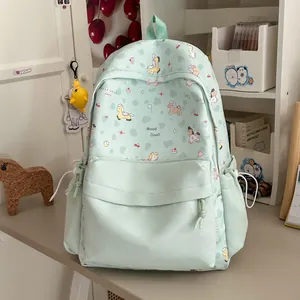 Detail view of mint green backpack with sweet cartoon pony pattern in room setting