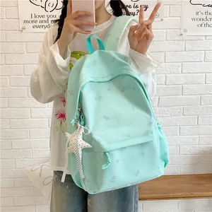 Mint green floral printed backpack for students with a cute star charm, stylish travel daypack