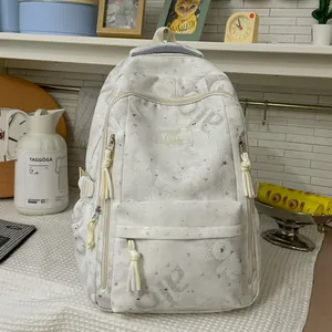 White large capacity backpack featuring subtle heart and bow patterns for school students and travel
