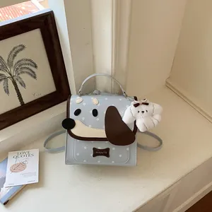 Light blue cute puppy face mini backpack for girls with a soft white plush dog charm