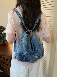 Sac à dos en jean délavé vintage avec plusieurs zips pour les trajets quotidiens