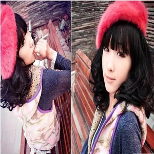 Soft pink rabbit fur beret hat for women styled on a model for a fashionable winter look