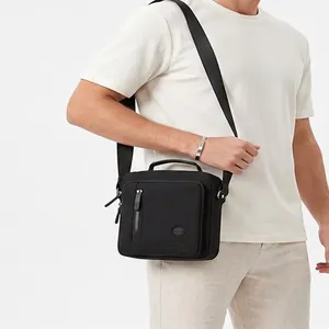 Men's large capacity black crossbody messenger bag with adjustable strap and handle