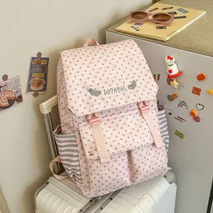 Pink star pattern backpack for women in a stylish lifestyle travel setting