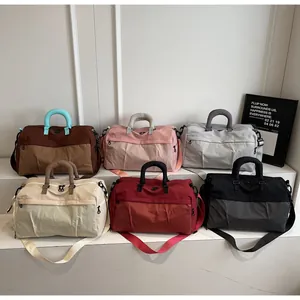 Selection of stylish travel duffel bags in multiple colors for short trips and commuting
