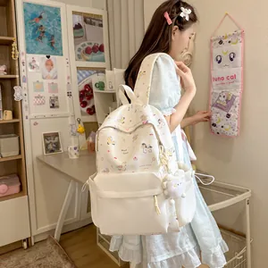 Detail view of a Japanese style cartoon backpack with sweet pony patterns worn by a model