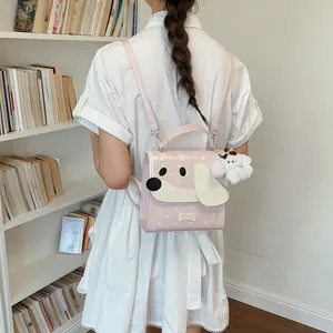 Detailed view of a cute pink dog-themed mini backpack worn in a library academy setting