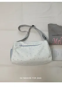 White gym bag with blue star pattern and adjustable shoulder strap