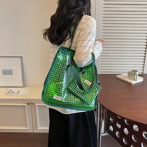 Back view of a stylish green grid mesh tote bag with a matching small inner pouch for commute