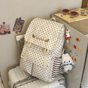 Stylish 2026 women's star pattern backpack shown in a cozy lifestyle indoor setting.