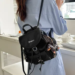 Versatile high-end stylish black commuter backpack for women worn as a shoulder bag