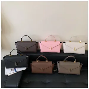 Fashion collection of trapezoidal handbags in six colors featuring elegant gold hardware
