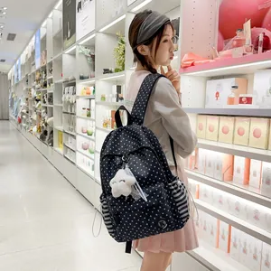 Korean style student backpack with white star pattern and cute plush cloud keychain
