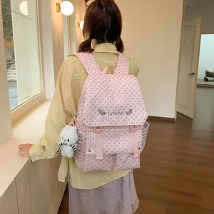 Fashionable pink backpack with star pattern and cute bunny plush charm for women