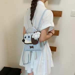 Light blue cute dog-themed mini backpack with a white puppy plush keychain detail