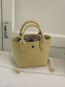 Petit Sac Seau pour Femmes Rétro Motif Litchi Cuir PU Sac à Main Avec Cordon Rayé Intérieur Sac à Bandoulière