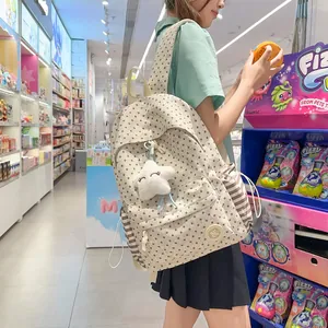Beige star-patterned backpack for students with a cute white star plush pendant