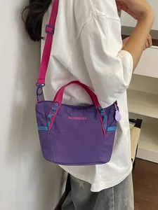 Large capacity purple and pink women's yoga fitness shoulder messenger bag on model