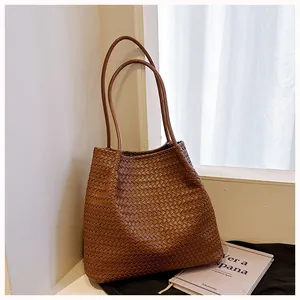 Premium vintage brown woven tote bag for women shown in a cozy lifestyle setting
