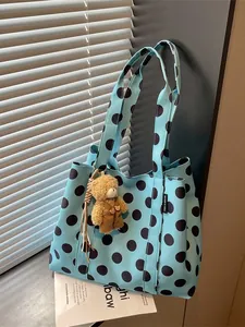 Stylish blue polka dot large capacity tote bag featuring a cute brown bear plush charm