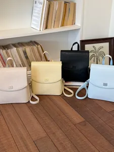 Minimalist textured women's backpack and handbag in multiple pastel colors for summer