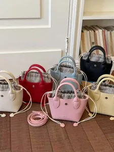 Mini sacs seaux rétro en plusieurs couleurs avec doublure à rayures et cordon