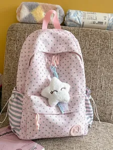 Pink star pattern school backpack with striped side pockets and cute plush star charm