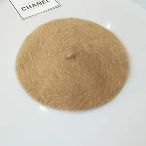 Detailed view of a soft beige rabbit fur beret fashion hat for women in autumn and winter