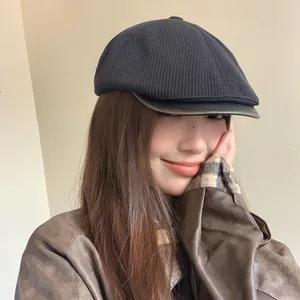 Vintage style knitted newsboy hat for women with a leather brim perfect for autumn fashion