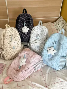 Set of five student backpacks with star patterns and plush star charms.