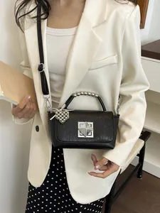 Summer chic black textured leather small square crossbody bag with silver beaded handle