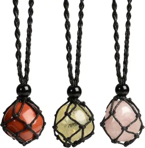 Detail view showing three hand-woven net necklaces with polished natural crystal pendants