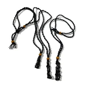 Close-up detail view of multiple hand-woven adjustable black net pouch necklaces for stones.