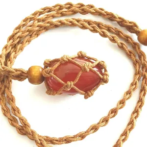 Hand-woven adjustable net necklace with large polished red carnelian gemstone pendant.