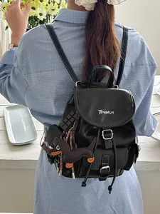 Stylish black leather backpack for women with dachshund charm and white stitching