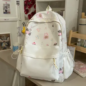 Detailed view of a cute cream student backpack featuring animal and floral prints
