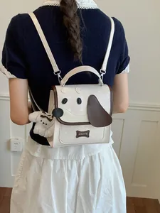 Cute cream-white mini backpack with cartoon dog face design and plush puppy charm