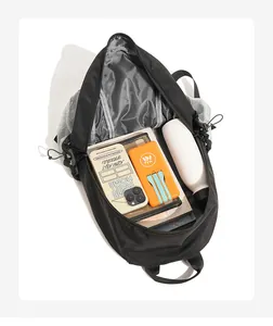 Close-up internal view of a black large capacity workwear backpack for storage